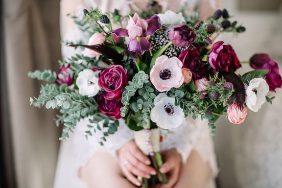Flowers A vibrant bouquet of mixed flowers in shades of pink, white, and deep red.