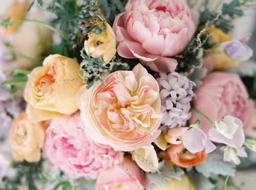 Hello petal!! A bouquet of soft pink, peach, and lavender flowers with green accents.