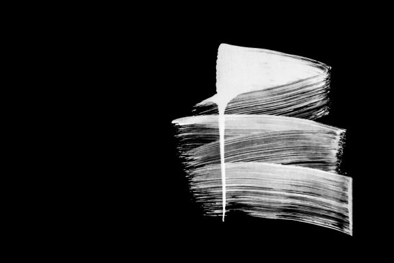 Swipe left or right? Abstract black background with white brush strokes creating a layered effect.